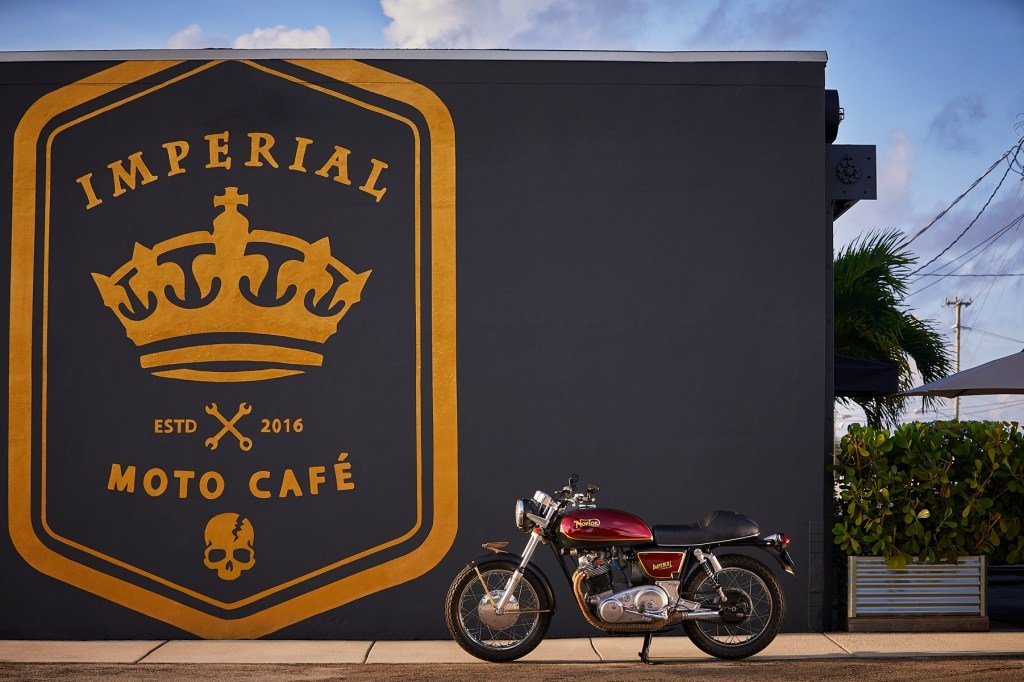 An engine parked in front of Cafe Imperial Moto, a cafe inspired by Fast Hogs.