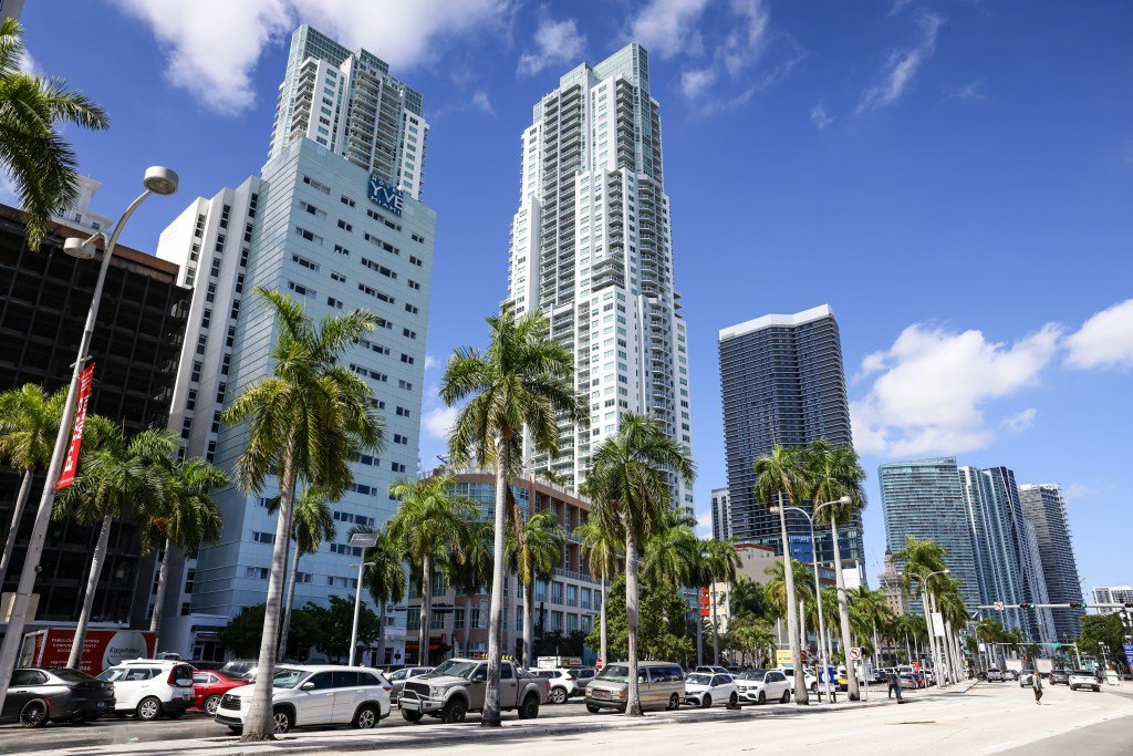In the city center of Miami Skyline with trading and residential buildings surrounded by Palma