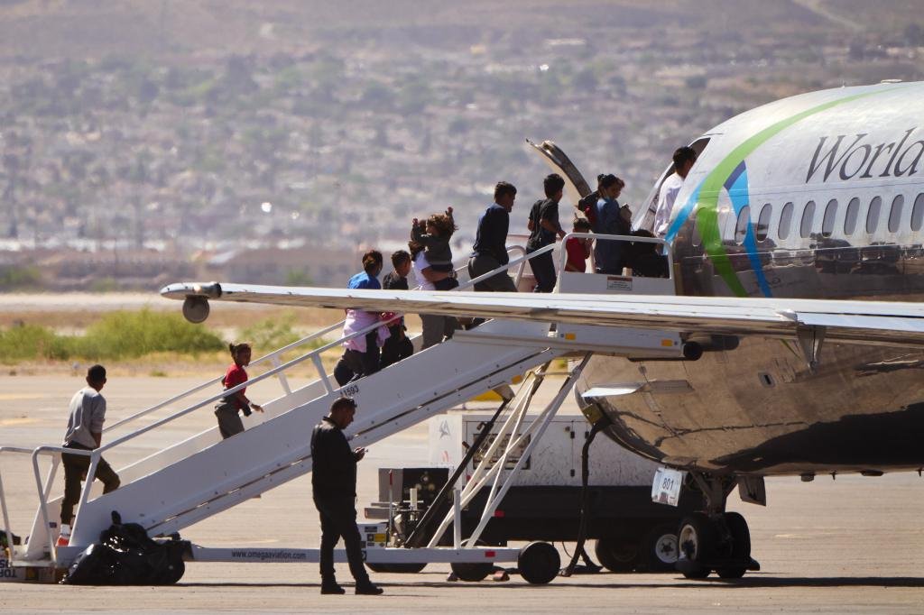 Board of migrants a World Atlantic Flight to El Paso International Airport on Wednesday, April 19, 2023 in El Paso, Texas.
